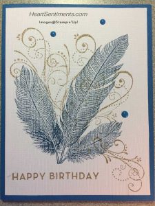 Card with three blue feathers