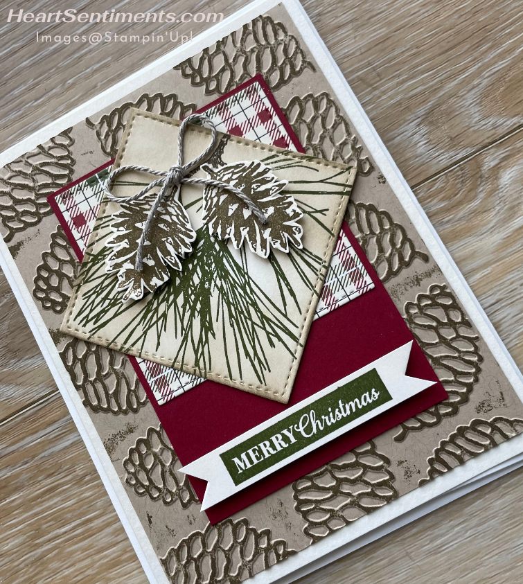 Rustic Christmas card with embossed pine cone background