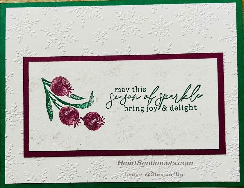 Christmas card with snowflake embossed background.